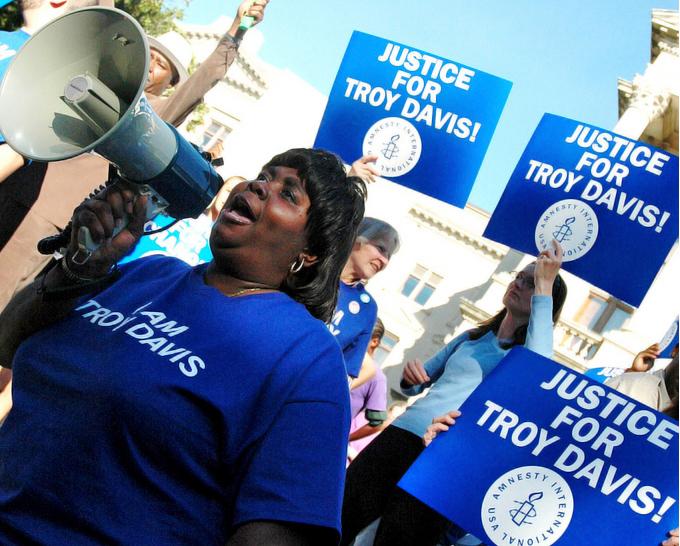 Protesters on the steps of the capitol building in Atlanta demand justice for Troy Davis