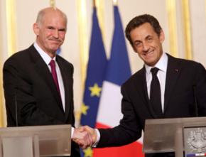 Greek Prime Minister George Papandreou shaking hands with French president Nicholas Sarkozy